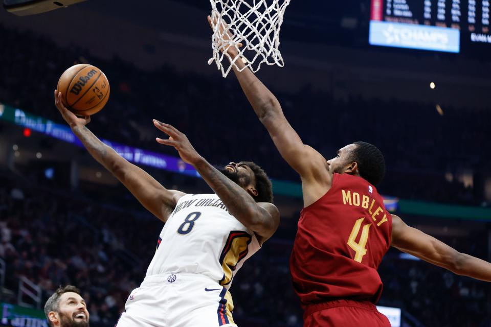 New Orleans Pelicans forward Naji Marshall (8) shoots against Cleveland Cavaliers forward Evan Mobley (4) during the first half of an NBA basketball game, Monday, Jan. 16, 2023, in Cleveland. (AP Photo/Ron Schwane)