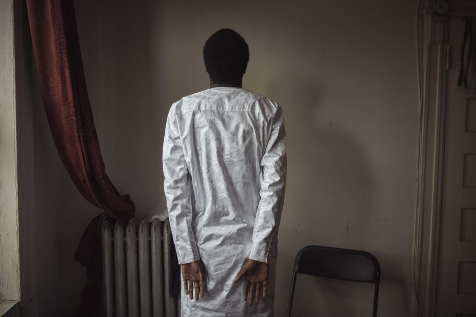 Abdoul, 32 year-old migrant from Maghama, Mauritania poses for a photograph at his shared apartment on Friday, Oct. 6, 2023, in New York. Abdoul traveled from Mauritania to New York via Istanbul, Bogota, El Salvador, Nicaragua, Honduras, Guatemala, Mexico and crossed the U.S. southern border in Texas on July 4, 2023. He now rents a room with a cousin and is awaiting a work permit. Then, he said, he will get a job and try to go to school until an immigration judge decides his future next spring. “When everything is finished and my case is guaranteed, I want to go to school because I started school and my dream is to be well educated,” Abdoul said. (AP Photo/Andres Kudacki)