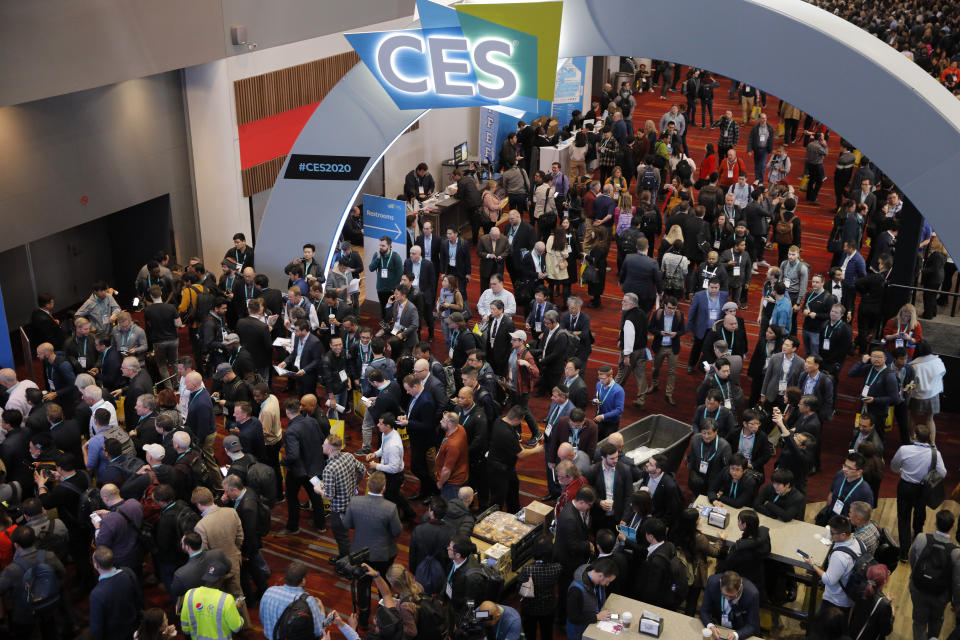 Crowds enter the convention center on the first day of the CES tech show, Tuesday, Jan. 7, 2020, in Las Vegas. (AP Photo/John Locher)