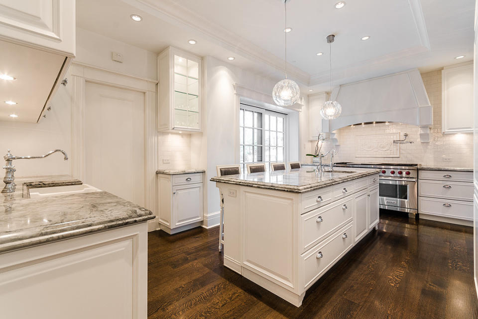 <p>The kitchen has granite countertops and stainless steel appliances, with a “butler’s pantry” located close by. (Listing via <span>Sotheby’s</span>) </p>