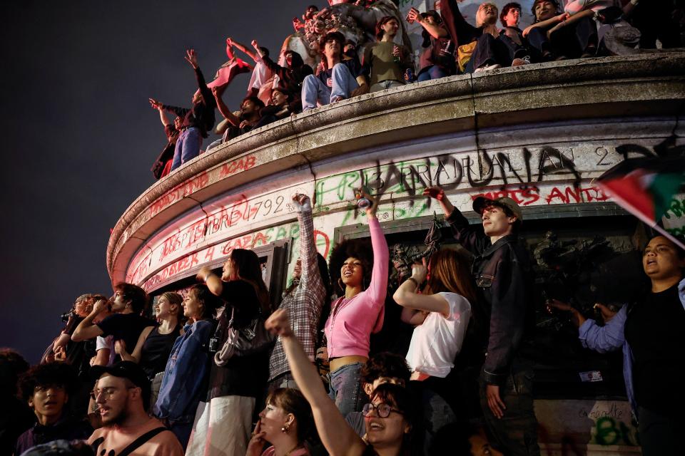 People react after the second round of the French legislative elections results at Place de la Republique in Paris, France, 07 July 2024 (EPA)