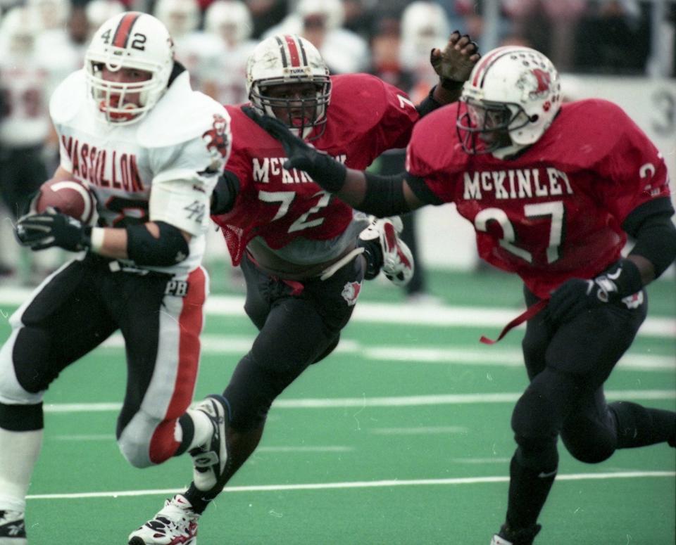 McKinley's Les Thompson (72) and Mike Doss (27) pursue a Massillon ball carrier in Week 10 of the Bulldogs' unbeaten, national championship season of 1997.