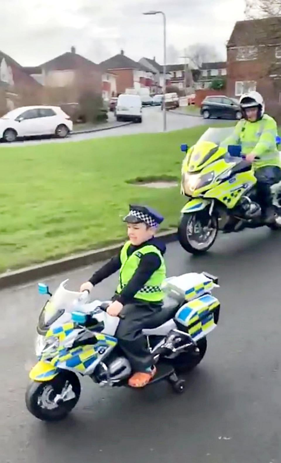 A five-year-old boy grieving his dad had his dream fulfilled when he became an honorary motorbike cop for the day.  See SWNS story SWSMcops.  Harry Farrell was left heartbroken when his former England youth footballer dad Craig died suddenly aged just 39.  Craig, who won three caps for England U-16s, was also a striker for Carlisle United, York City and Whitby Town, died last May.  Little Harry, who dreams of being a cop when he grows up, asked Santa Claus for an electric police motorbike for Christmas.  Last week his dream of being a cop came true when Durham Constabulary&#x92;s Motorcycle Section surprised him at his home.  Video shows Harry &#x96; wearing a police uniform - leading a four-man patrol around the streets of his home in Durham.  The surprise was arranged by Harry&#x92;s mum Emma Overton. 