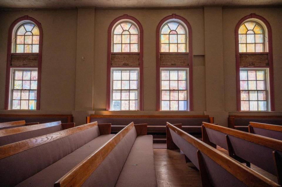 Stained glass windows adorn the great hall of the Justice and Dignity Center building on Wednesday, March 20, 2024, in Kansas City. Once called Carpenters’ Hall, it hosted some lively political meetings.