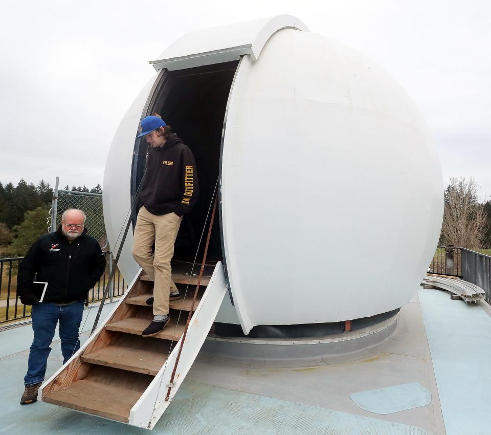 Battle Point Astronomical Association chief scientist Steve Ruhl stands to the side as chief astronomer Cole Rees descends the stairs at the Edwin E. Ritchie Observatory in Bainbridge Island's Battle Point Park on Thursday, Feb. 16, 2023.