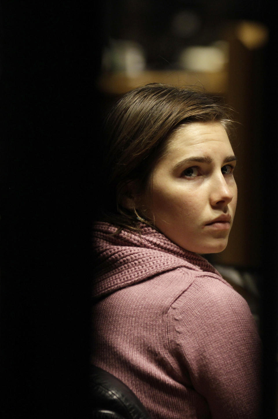 File- This Dec. 18, 2010 file photo shows convicted U.S. student Amanda Knox attends a hearing in her appeals trial, at Perugia's courthouse, Italy. To many Americans, especially in her hometown of Seattle, Amanda Knox seems the victim, unfairly hounded by a capricious foreign legal system for the death of a 21-year-old British woman. But in Italy and elsewhere in Europe, others see her as someone who got away with murder, embroiled in a case that continues to make global headlines and reinforces a negative image of Americans behaving badly, even criminally, abroad without any punishment. As she remains free in the U.S., these perceptions will not only fuel the debate about who killed Meredith Kercher in 2007 and what role, if any, Knox played in her death, but also about whether U.S. authorities should, if asked, send her to Italy to face prison. (AP Photo/Alessandra Tarantino, File)