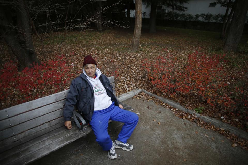 Shizuya Nishiyama, a 57-year-old homeless man from Hokkaido, rests on a bench at a park near Sendai Station in Sendai