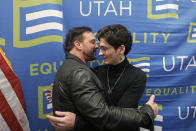 Justin Utley, left, and Nathan Dalley, right, hug following a news conference about the discredited practice of conversion therapy for LGBTQ children, now banned in Utah Wednesday, Jan. 22, 2020, at the Utah State Capitol, in Salt Lake City. Utley and Dalley both under went so-called conversion therapy. (AP Photo/Rick Bowmer)