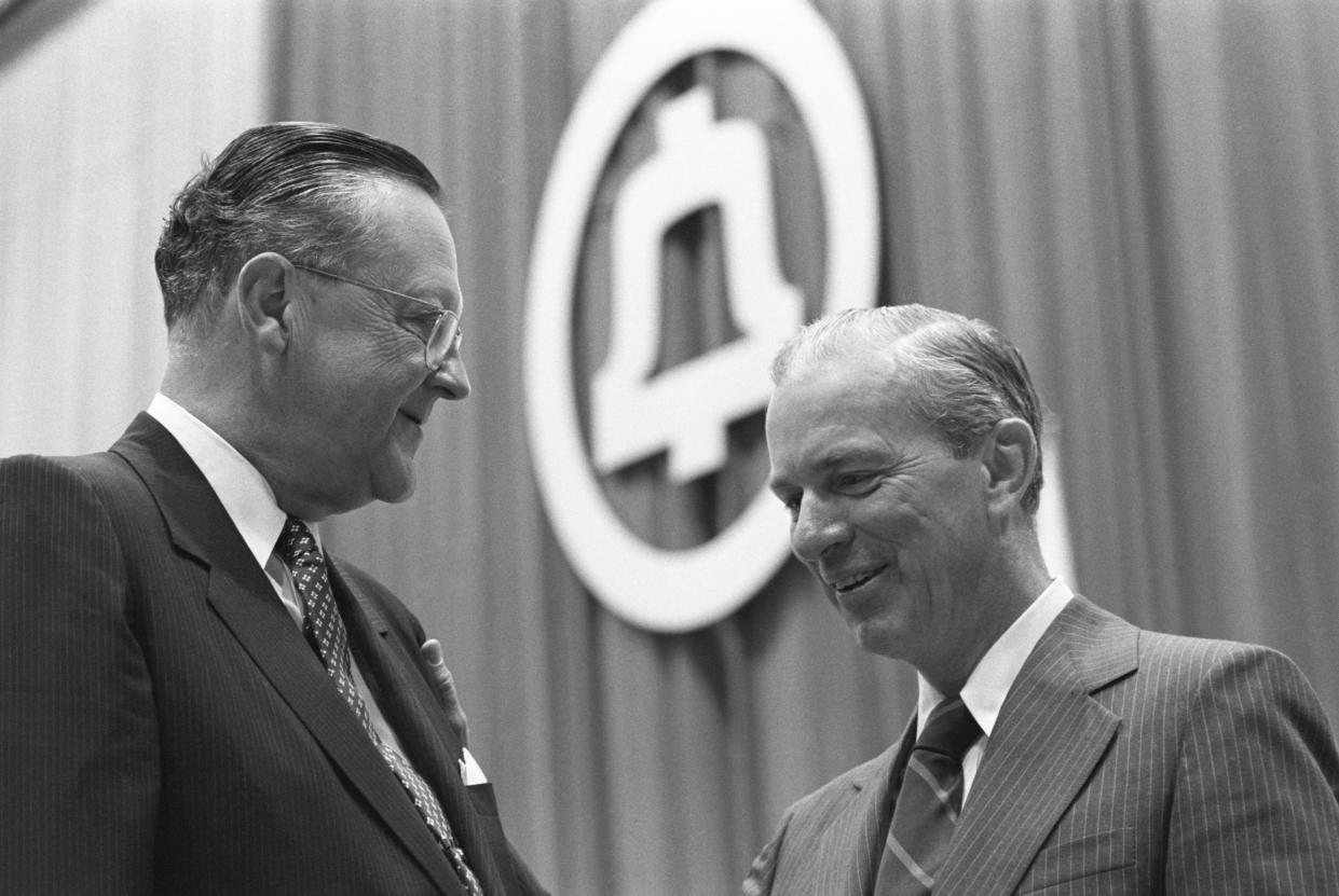 AT&T Company Chairman John DeButts and its President and Director Charles L. Brown have a few words before the share owner's 92nd annual meeting.