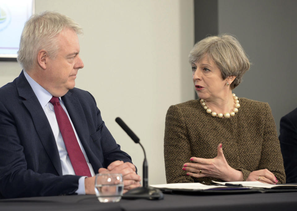 Britain's Prime Minister Theresa May and First Minister of Wales Carwyn Jones, left, attend a bilateral meeting at the Liberty Stadium in Swansea, Wales, Monday March 20, 2017. The European Commission says it has been informed in advance of Britain's plans to trigger its exit from the EU on March 29 and stands ready to help launch the negotiations. (Ben Birchall/PA via AP)