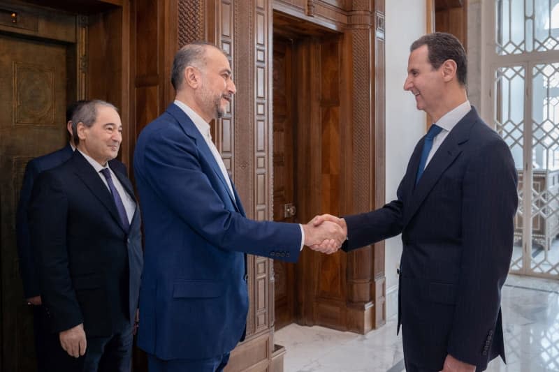 A photo released by the official Syrian Arab news agency (SANA) on 08 April 2024 shows Syrian President Bashar al-Assad meeting with Iranian Foreign Minister Hossein Amir-Abdollahian. -/SANA/dpa