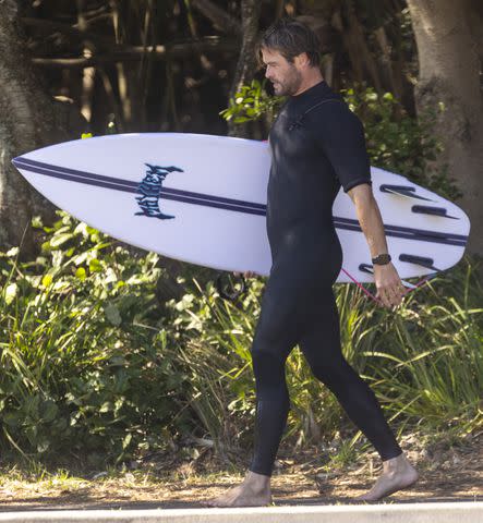 <p>SplashNews.com</p> Chris Hemsworth celebrates his 40th birthday on Friday with a surfing session at Australia's Byron Bay