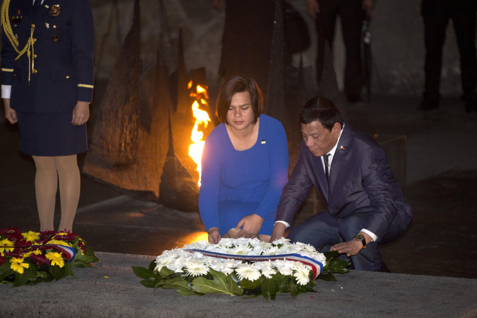 Philippine President Rodrigo Duterte and his daughter Sara lay a wreath during a memorial ceremony at the Yad Vashem Holocaust Memorial in Jerusalem, Monday, Sept 3, 2018. (AP Photo/Oded Balilty)