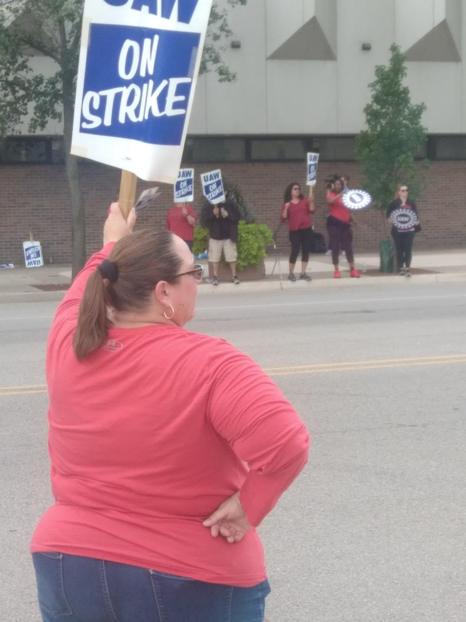 Kera Tennyson, a member of UAW Local 2256, joined co-workers on the picket line after the union began a strike against Blue Cross Blue Shield of Michigan on Wednesday, Sept. 13, 2023.