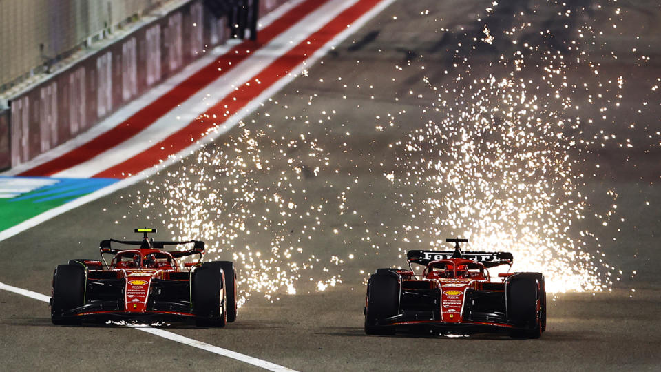Ferrari drivers Carlos Sainz and Charles Leclerc compete against each other during Formula 1's 2024 Bahrain Grand Prix.
