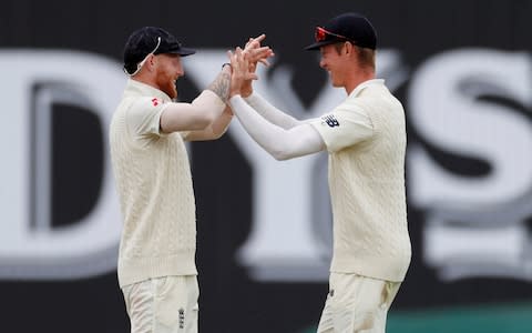 England's Keaton Jennings celebrates with Ben Stokes after taking a catch to dismiss India's Ajinkya Rahane - Credit: Action Images via Reuters/Paul Childs