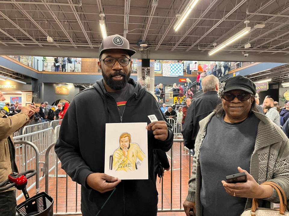 Cameron Blakey, 46, of Mogadore shows his sketch that he drew of Star Trek character Captain James T. Kirk that he got the actor who played Kirk, William Shatner, to autograph Saturday at Hartville MarketPlace. With him is Karen Isaiah of Mogadore who was thrilled to briefly meet Shatner.