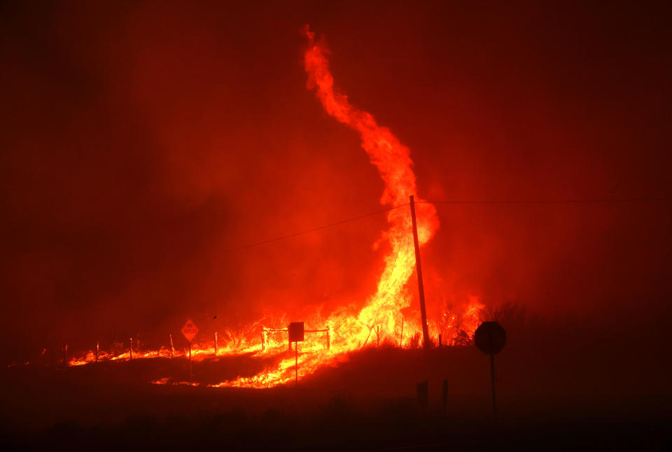  A fire whirl kicks up as the dixie fire burns through the area on August 16, 2021 near Janesville, California.  / Credit: / Getty Images