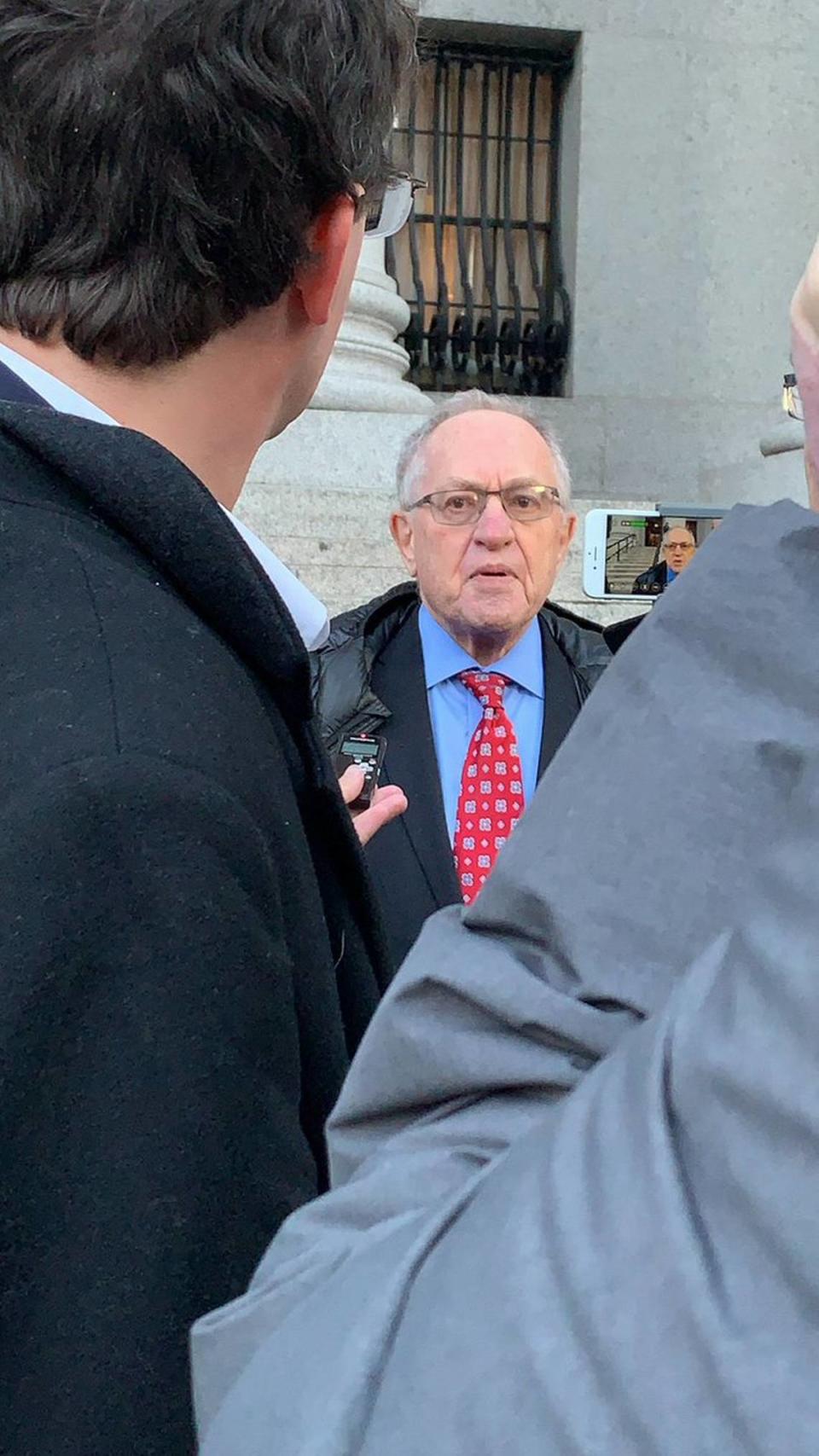 Famed First Amendment attorney Alan Dershowitz speaks outside the courtroom in New York after an earlier hearing on a sealed lawsuit involving his friend and former client, Jeffrey Epstein.