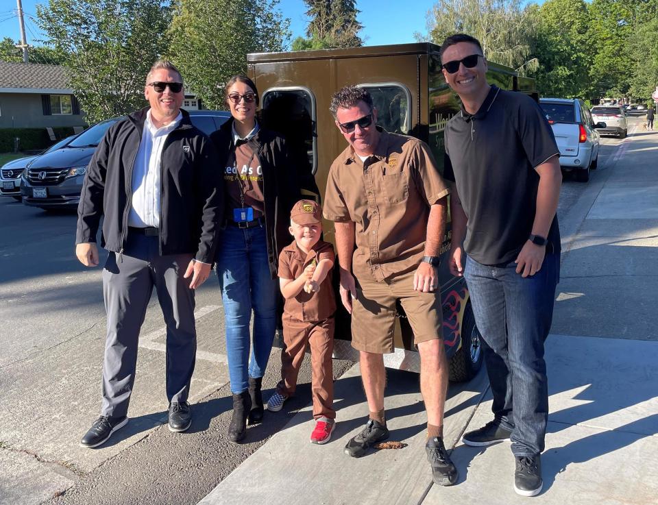 Drew Bausman, center, loved everything about his big day as a UPS driver. (Courtesy Becky Bausman)
