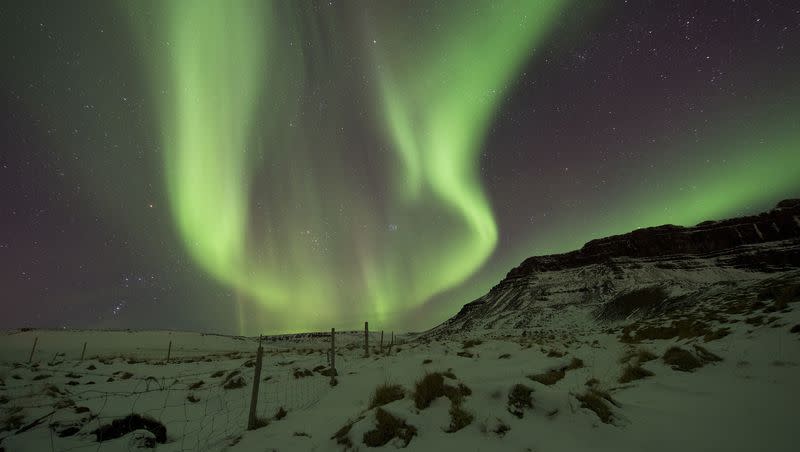 In this March 1, 2017, file photo, the northern lights, or aurora borealis, appear in the sky over Bifrost, Western Iceland.