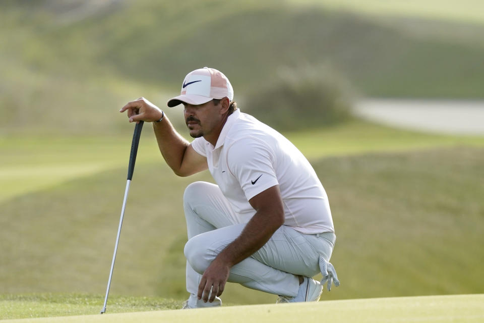 Brooks Koepka works on the 16th green during the third round at the PGA Championship golf tournament on the Ocean Course, Saturday, May 22, 2021, in Kiawah Island, S.C. (AP Photo/Matt York)