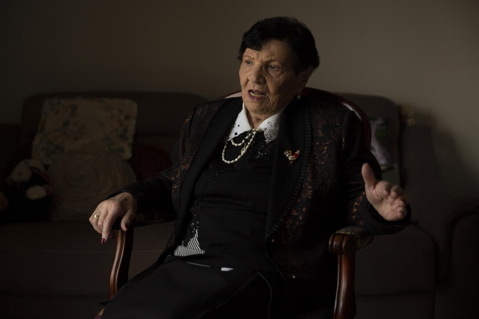 In this Wednesday, Jan. 23, 2019 photo, Holocaust survivor Cipora Feivlovich speaks to The Associated Press at her house in Jerusalem. As the world commemorates the anniversary of the liberation of Auschwitz on International Holocaust Remembrance Day, death camp survivor Feivlovich marks her own personal milestone as she turns 92. She’s spent her most recent birthdays recounting to audiences in Israel and Germany her harrowing experiences in the infamous camp, where her parents, brother and best friends all perished. (AP Photo/Sebastian Scheiner)