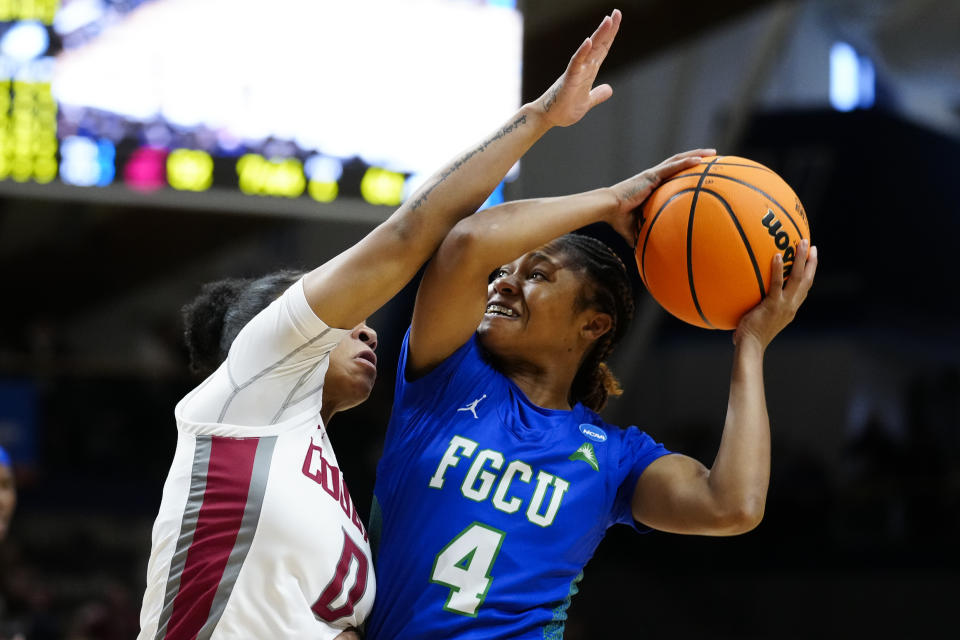 Florida Gulf Coast's Tishara Morehouse, right, shoots against Washington State's Kaia Woods during the second half of a first-round college basketball game in the NCAA Tournament, Saturday, March 18, 2023, in Villanova, Pa. (AP Photo/Matt Rourke)