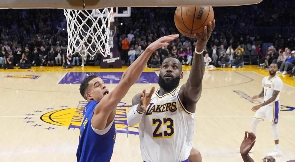 <a class="link " href="https://sports.yahoo.com/nba/teams/la-lakers/" data-i13n="sec:content-canvas;subsec:anchor_text;elm:context_link" data-ylk="slk:Los Angeles Lakers;sec:content-canvas;subsec:anchor_text;elm:context_link;itc:0">Los Angeles Lakers</a> forward <a class="link " href="https://sports.yahoo.com/nba/players/3704/" data-i13n="sec:content-canvas;subsec:anchor_text;elm:context_link" data-ylk="slk:LeBron James;sec:content-canvas;subsec:anchor_text;elm:context_link;itc:0">LeBron James</a> (23) scores as <a class="link " href="https://sports.yahoo.com/nba/teams/denver/" data-i13n="sec:content-canvas;subsec:anchor_text;elm:context_link" data-ylk="slk:Denver Nuggets;sec:content-canvas;subsec:anchor_text;elm:context_link;itc:0">Denver Nuggets</a> forward <a class="link " href="https://sports.yahoo.com/nba/players/6025/" data-i13n="sec:content-canvas;subsec:anchor_text;elm:context_link" data-ylk="slk:Michael Porter Jr.;sec:content-canvas;subsec:anchor_text;elm:context_link;itc:0">Michael Porter Jr.</a> (1), defends, becoming the first NBA player to reach 40,000 points in a career, during the first half of an NBA basketball game Saturday, March 2, 2024, in <a class="link " href="https://sports.yahoo.com/nba/teams/la-lakers/" data-i13n="sec:content-canvas;subsec:anchor_text;elm:context_link" data-ylk="slk:Los Angeles;sec:content-canvas;subsec:anchor_text;elm:context_link;itc:0">Los Angeles</a>. (AP Photo/Mark J. Terrill)