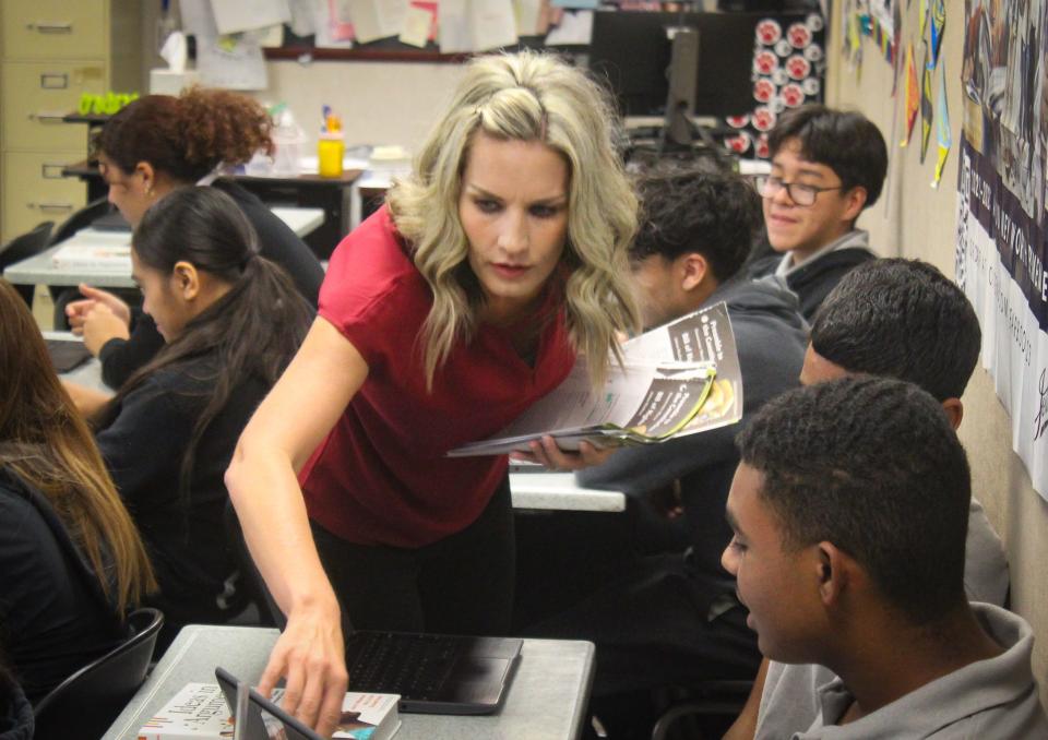 University Preparatory School teacher Anna Lovato explains a lesson to student Jimarr Whitaker. Victor Valley Union High School District’s University Prep. was among 21 schools in San Bernardino County to receive state recognition.