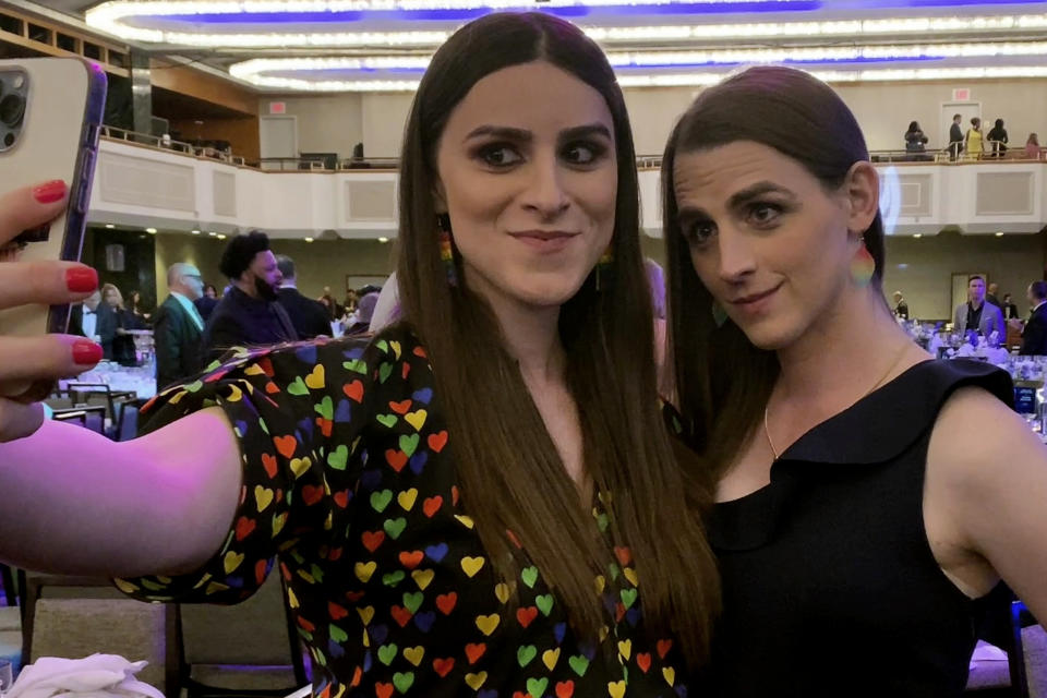 Legislative researcher Erin Reed, left, takes a selfie with her fiancee, Montana state Rep. Zooey Zephyr, at the GLAAD Media Awards in New York, Saturday, May 13, 2023. Largely unknown just a few months ago, Zephyr and Reed have quickly become a power couple in the world of LGBTQ+ advocacy, spreading hope to fellow transgender people at Pride events around the U.S. this summer.(AP Photo/Jeff McMillan)