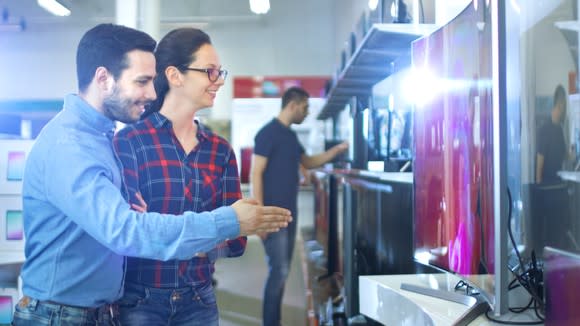 Young couple at electronics store