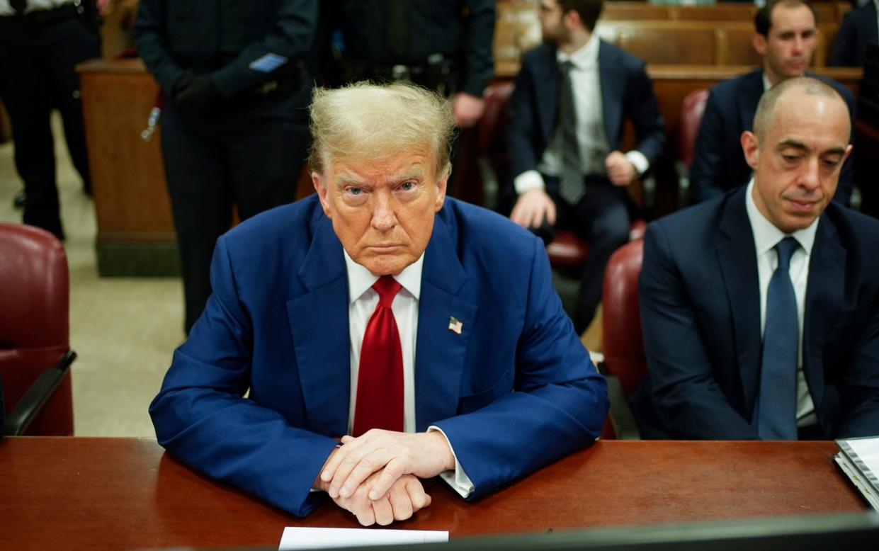 Donald Trump awaiting the start of proceedings in his trial on Tuesday