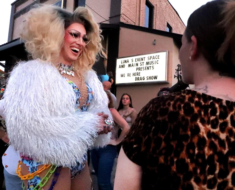 Nashville Drag Queen Perplexity talks with Jessie Dodd, from Watertown as Perplexity mingles and talks with the crowd waiting to get into the venue before the start of the HBO documentary "We're Here" drag show presented by Luna's Event Space and Main Street Music in Murfreesboro, on Friday, Aug. 11, 2023. 