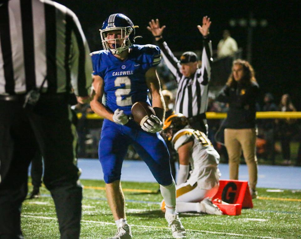 Caldwell's Harry Boland reacts after scoring a touchdown against Cedar Grove during the first half of a football game at Caldwell High School on Oct. 14, 2022.