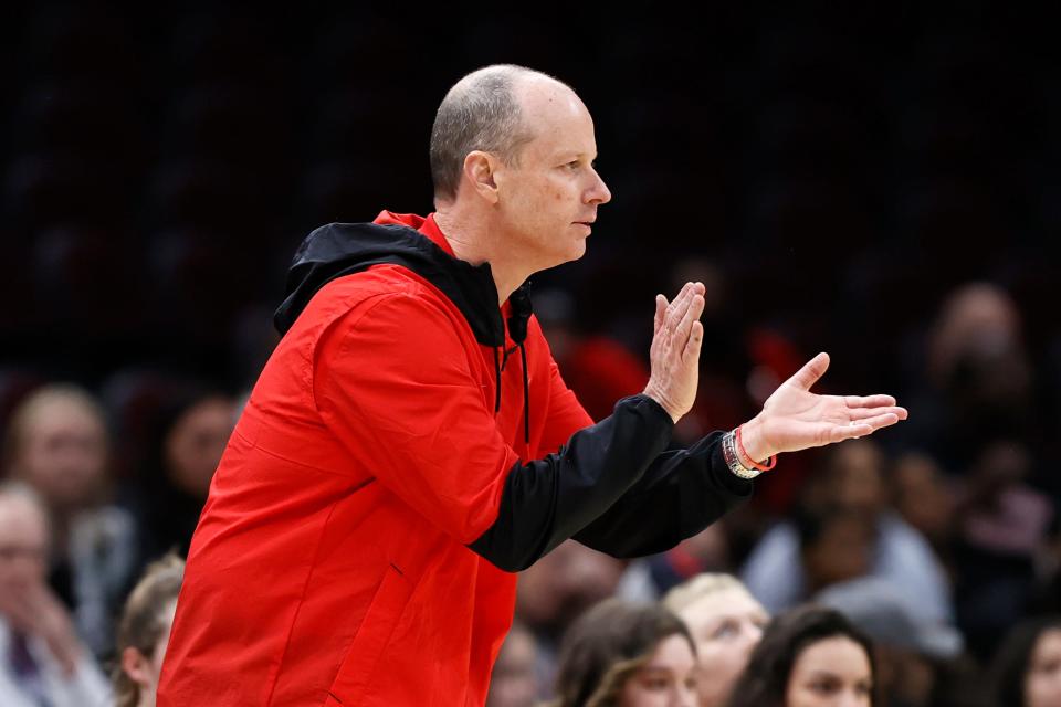 Ball State head coach Brady Sallee cheers on his team during the first half of an NCAA college basketball game against Buffalo for the championship of the Mid-American Conference women's tournament, Saturday, March 12, 2022, in Cleveland. (AP Photo/Ron Schwane)