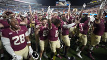 Florida State players celebrate after defeating LSU in an NCAA college football game Sunday, Sept. 3, 2023, in Orlando, Fla. (AP Photo/John Raoux)