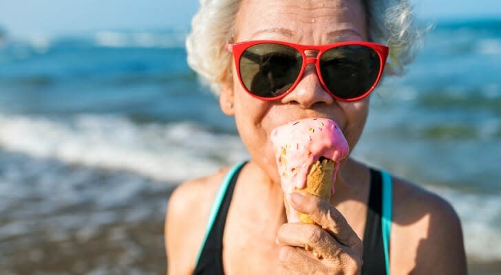 Retired woman eating an ice cream cone