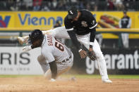Detroit Tigers' Akil Baddoo, left, steals second base against Chicago White Sox shortstop Elvis Andrus during the seventh inning of a baseball game in Chicago, Friday, Sept. 23, 2022. (AP Photo/Nam Y. Huh)