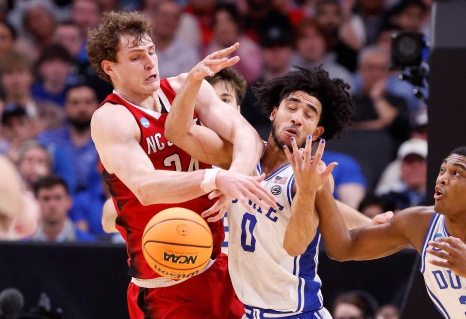 N.C. State’s Ben Middlebrooks (34) fights for a rebound with Duke’s Jared McCain (0) during the first half of N.C. State’s game against Duke in their NCAA Tournament Elite Eight matchup at the American Airlines Center in Dallas, Texas, Sunday, March 31, 2024.