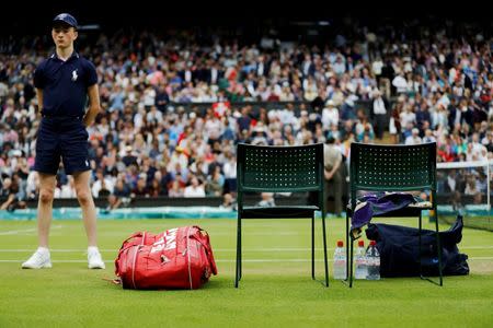 The gear of Argentina's Juan Martin Del Potro is seen on Centre Court during his match against Switzerland's Stan Wawrinka at the Wimbledon Tennis Championships in London, Britain July 1, 2016. REUTERS/Stefan Wermuth