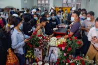 People attend the funeral of Angel, 19-year-old protester also known as Kyal Sin who was shot in the head as Mynamar forces opened fire to disperse an an anti-coup demonstration in Mandalay
