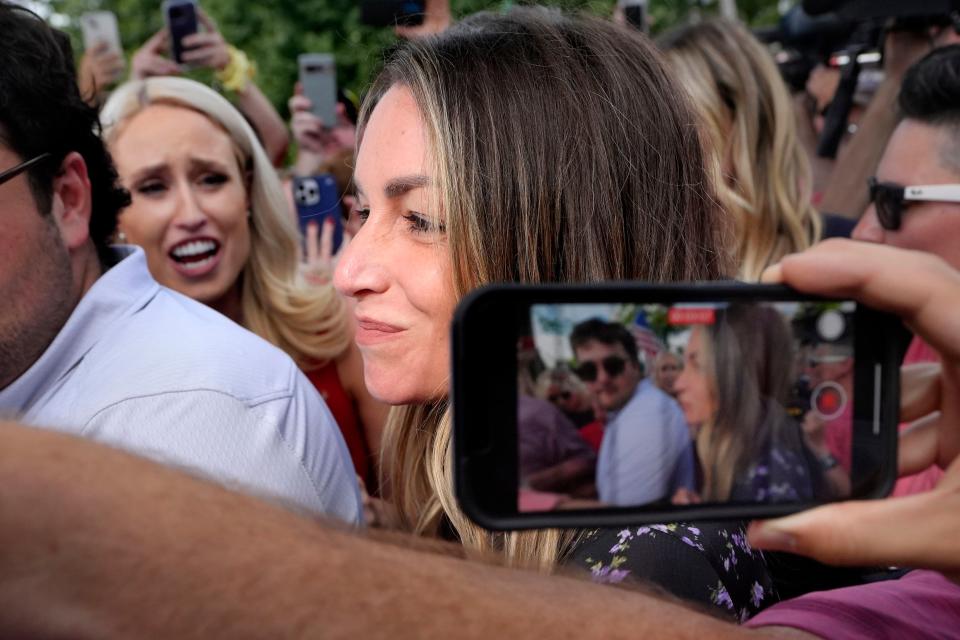 Karen Read, center, departs Norfolk Superior, Tuesday, June 25, 2024, in Dedham, Mass. Read is on trial, accused of killing her boyfriend Boston police Officer John O'Keefe, in 2022. Jury deliberations began in the trial Tuesday afternoon. (AP Photo/Steven Senne)