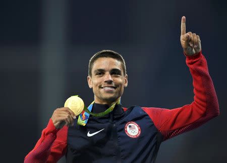 2016 Rio Olympics - Athletics - Victory Ceremony - Men's 1500m Victory Ceremony - Olympic Stadium - Rio de Janeiro, Brazil - 20/08/2016. Matthew Centrowitz (USA) of USA poses with his gold medal. REUTERS/Dylan Martinez