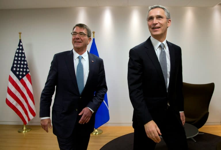 US Secretary of Defense Ash Carter (L) walks with NATO Secretary General Jens Stoltenberg at NATO headquarters in Brussels on February 10, 2016