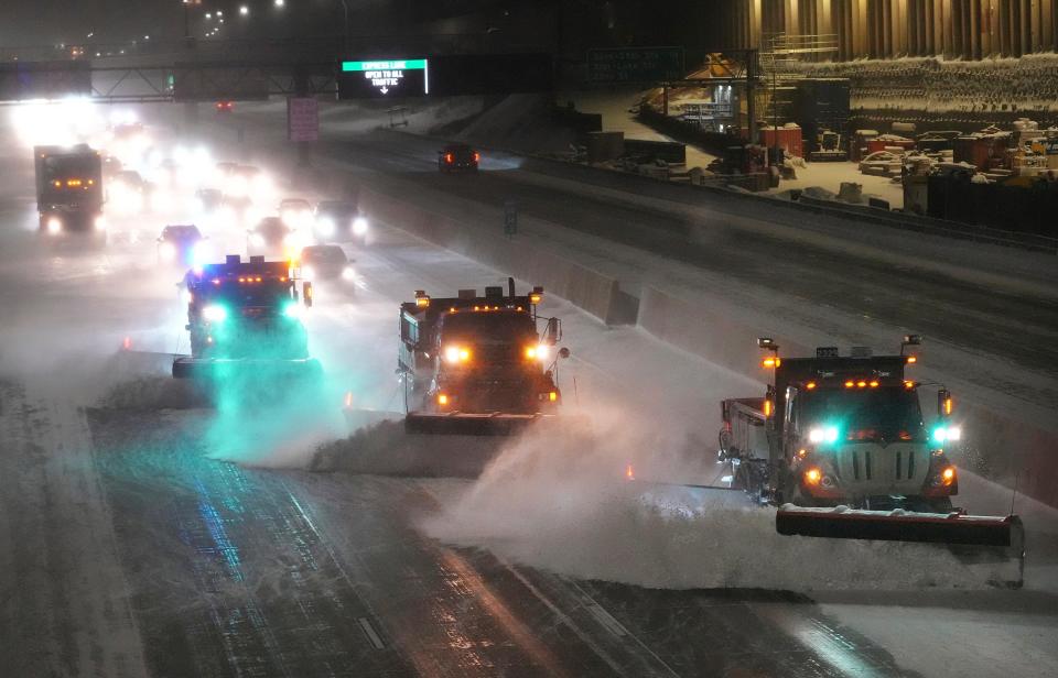 Snow plows hit the interstate highway I-35 as Minnesota prepares for a winter storm, early on Wednesday, in Minneapolis. Brutal winter weather bringing snow, dangerous gusts of wind and bitter cold settled over much of the northern US on Wednesday (David Joles/Star Tribune via AP) (AP)