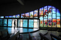 A man walks inside the Cathedral of St. Paul of Abidjan, February 11, 2013. Pope Benedict stunned the Roman Catholic Church on Monday when he announced he would stand down, the first pope to do so in 700 years, saying he no longer had the mental and physical strength to carry on. REUTERS/Thierry Gouegnon (IVORY COAST - Tags: RELIGION) - RTR3DNO9