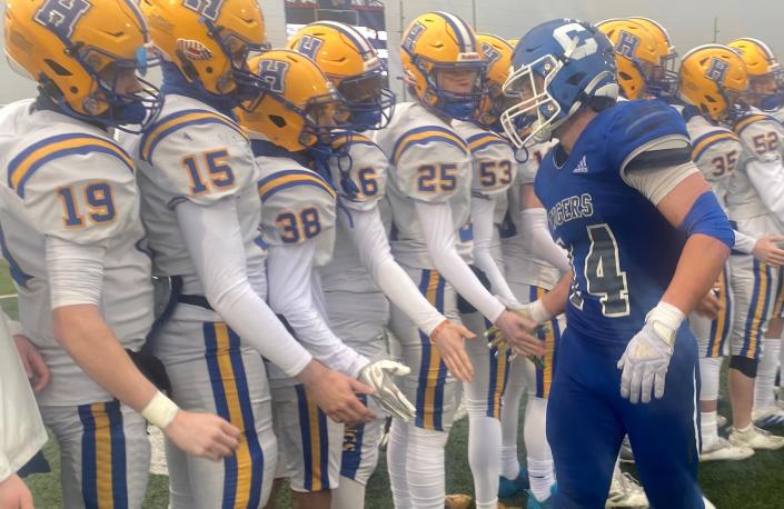 Several Francis Howell players shake Carthage running back Luke Gall's hand after the senior standout played his final high school game, a 35-13 loss to in the Class 5 semifinals on Saturday at David Haffner Stadium.