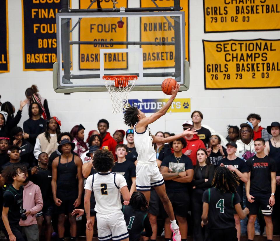 South Bend Riley senior Payton Baird puts up a reverse layup during a boys basketball game against South Bend Washington Thursday, Feb. 1, 2024, at Riley High School.