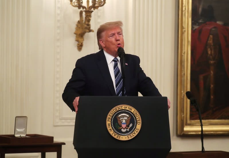 U.S. President Donald Trump presents the Presidential Citizens Medal in the East Room of the White House in Washington